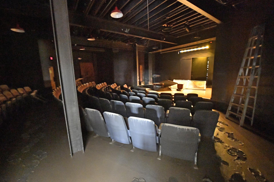 The Roadside Theatre at the Appalshop facility lies covered in mud in Whitesburg, Ky., Saturday, July 30, 2022. Appalshop is a media, arts, and education center created during the War on Poverty, in 1969. (AP Photo/Timothy D. Easley)