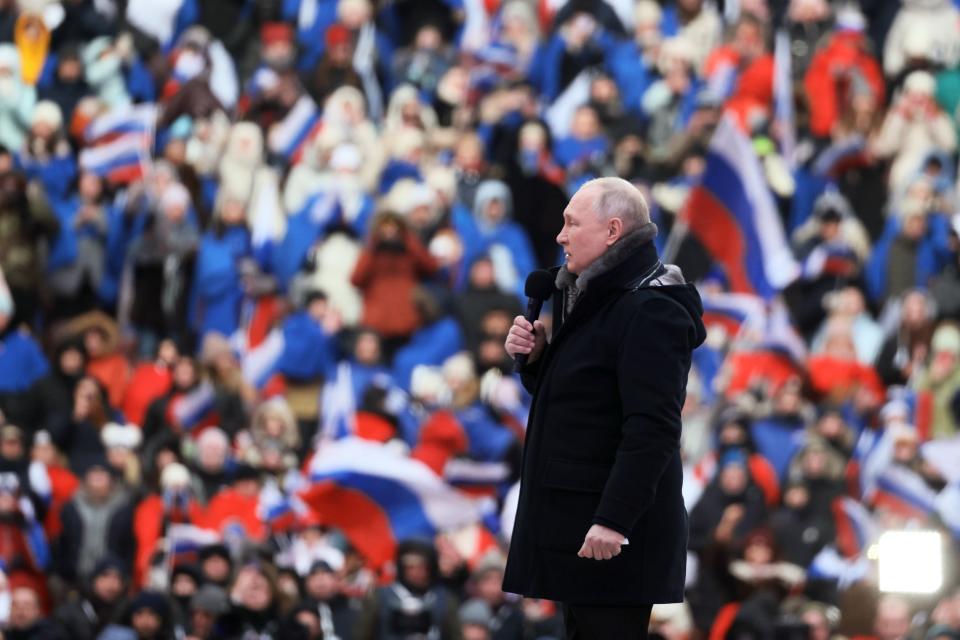 Russian President Vladimir Putin speaks during the ''Glory to the Defenders of the Fatherland'' concert, a day before the Defender of the Fatherland Day, a holiday honoring Russia's armed forces at the Luzhniki Stadium in Moscow, Russia, Wednesday, Feb. 22, 2023. (Mikhail Metzel, Sputnik, Kremlin Pool Photo via AP)