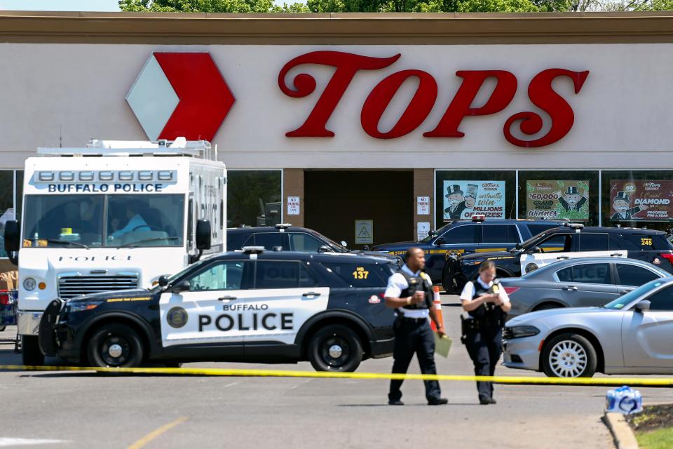 Police officers in front of grocery store.