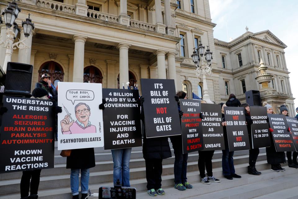 Vaccine protesters join a &quot;Stop the Steal&quot; rally in support of President Donald Trump in Lansing, Mich., in November. (Jeff Kowalsky/AFP via Getty Images)