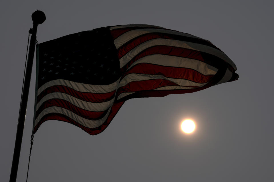 FILE - A haze is seen from Canadian wildfires June 27, 2023, in Whitefish Bay, Wis. Forecasters say there won’t be large breaks for much of America anytime soon from eye-watering dangerous smoke from fire-struck Canada. (AP Photo/Morry Gash, File)