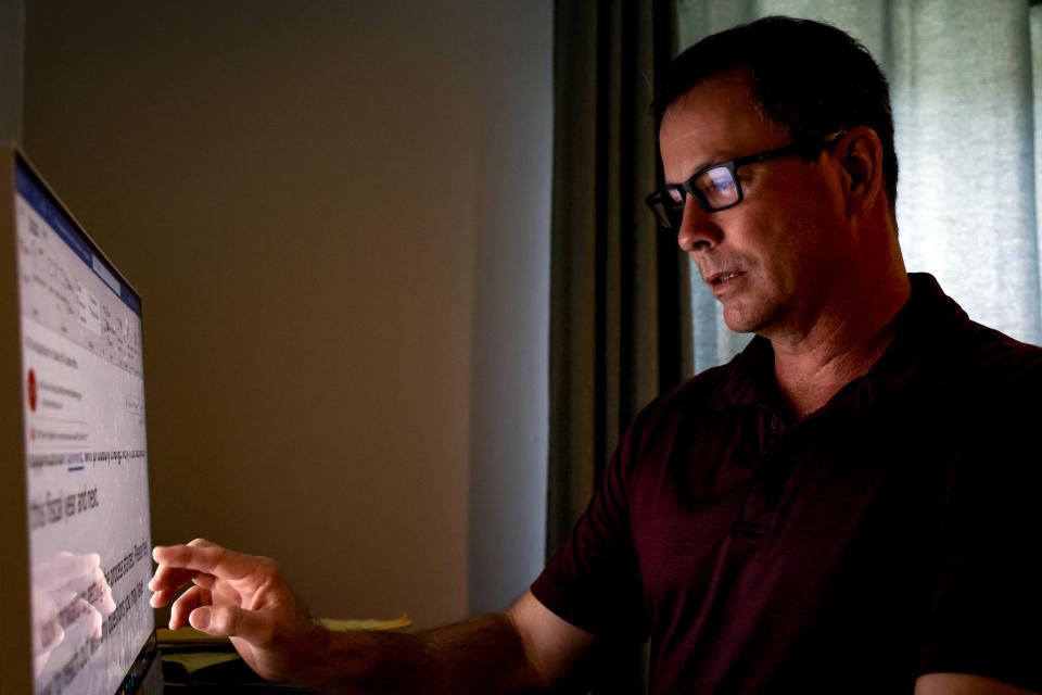 Phil Durst works on his computer in Homewood, Ala., on Tuesday, Aug. 15, 2023. Durst underwent an experimental procedure that aims to treat severe injuries in one eye with stem cells from the other. “I went from completely blind with debilitating headaches and pondering if I could go another day — like really thinking I can’t do this anymore" to seeing well enough to drive and emerging from dark places literally and figuratively, he says. (AP Photo/Butch Dill)