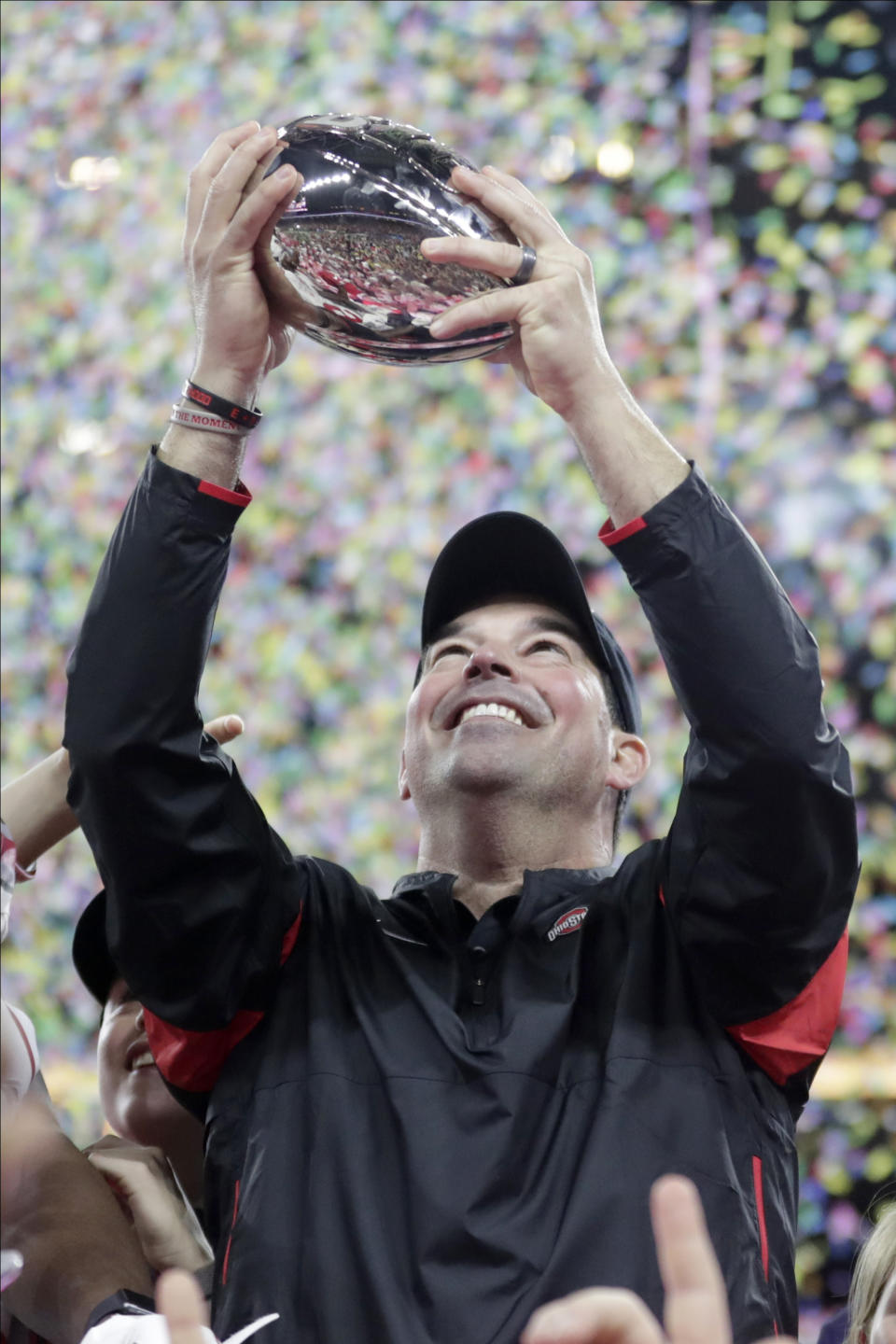 Ohio State coach Ryan Day holds the trophy following the Big Ten championship NCAA college football game against Wisconsin, early Sunday, Dec. 8, 2019, in Indianapolis. Ohio State won 34-21. (AP Photo/Michael Conroy)