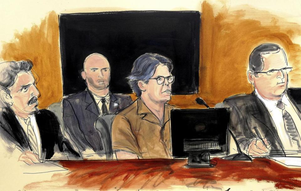 In the dock: a courtroom sketch of Keith Raniere, in the brown shirt