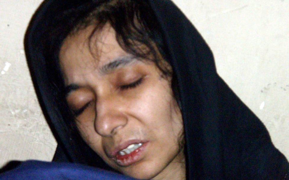 Aafia Siddiqui is seen in the custody of Counter Terrorism Department of Ghazni province in Ghazni City, Afghanistan in 2008 - AP