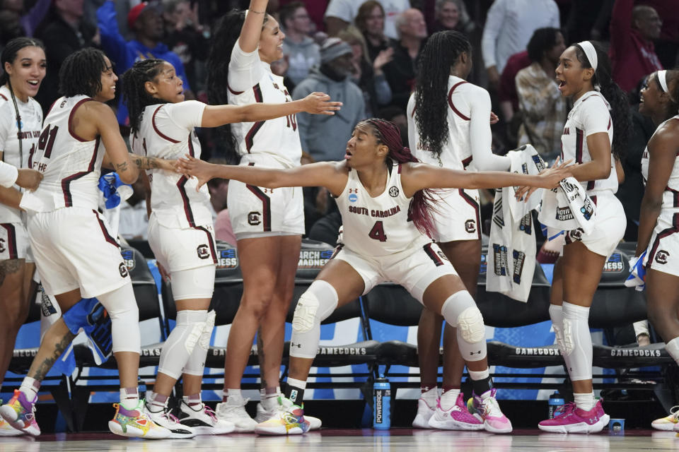 South Carolina forward Aliyah Boston (4) holds back teammates during the second half in a second-round college basketball game against South Florida in the NCAA Tournament, Sunday, March 19, 2023, in Columbia, S.C. (AP Photo/Sean Rayford)