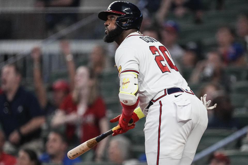 Atlanta Braves designated hitter Marcell Ozuna watches his home run in the fourth inning of a baseball game against the New York Mets, Monday, Aug. 21, 2023, in Atlanta. (AP Photo/John Bazemore)