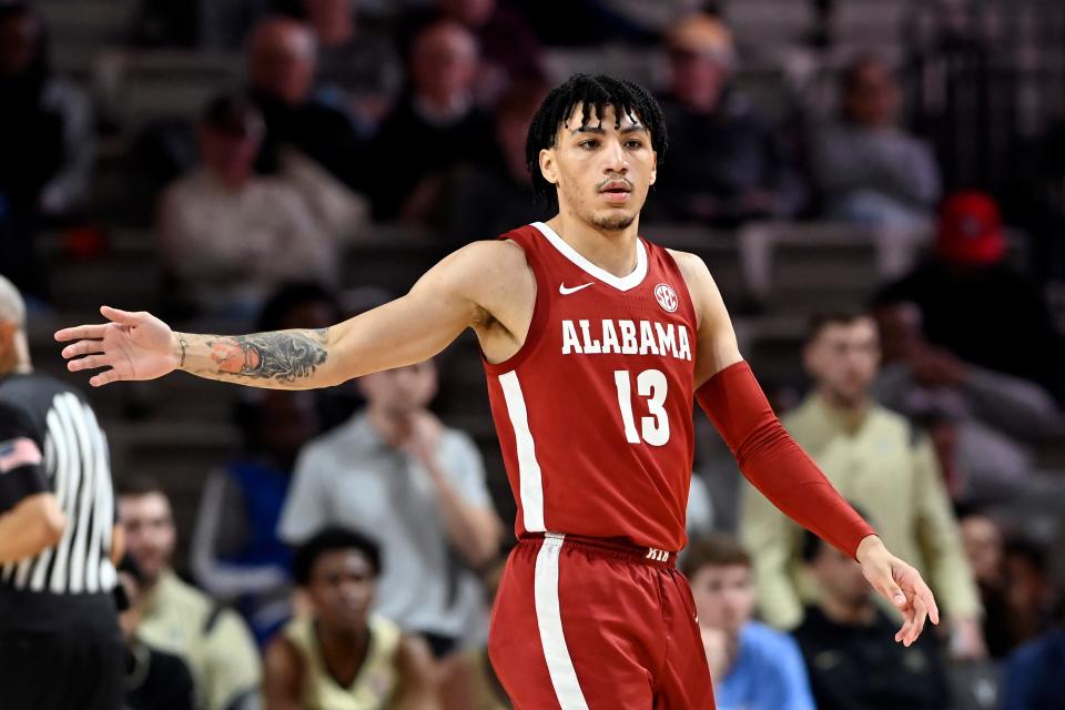 Alabama guard Jahvon Quinerly (13) plays against Vanderbilt during the second half of an NCAA college basketball game Tuesday, Feb. 22, 2022, in Nashville, Tenn. (AP Photo/Mark Zaleski)