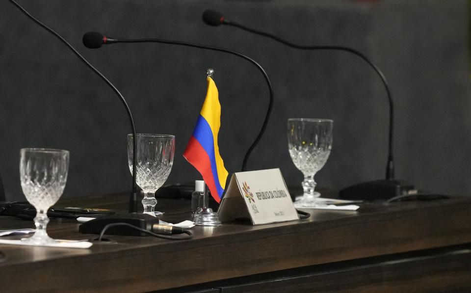 A miniature Colombian national flag marks the seat of Colombian President Gustavo Petro, during the Amazon Summit at the Hangar Convention Center in Belem, Brazil, Wednesday, Aug. 9, 2023. Petro remained at his hotel in Belem taking calls, after revelations Tuesday that a rebel group, the National Liberation Army, had been plotting to assassinate the nation’s attorney general, according to a source from the presidency’s office. (AP Photo/Eraldo Peres)