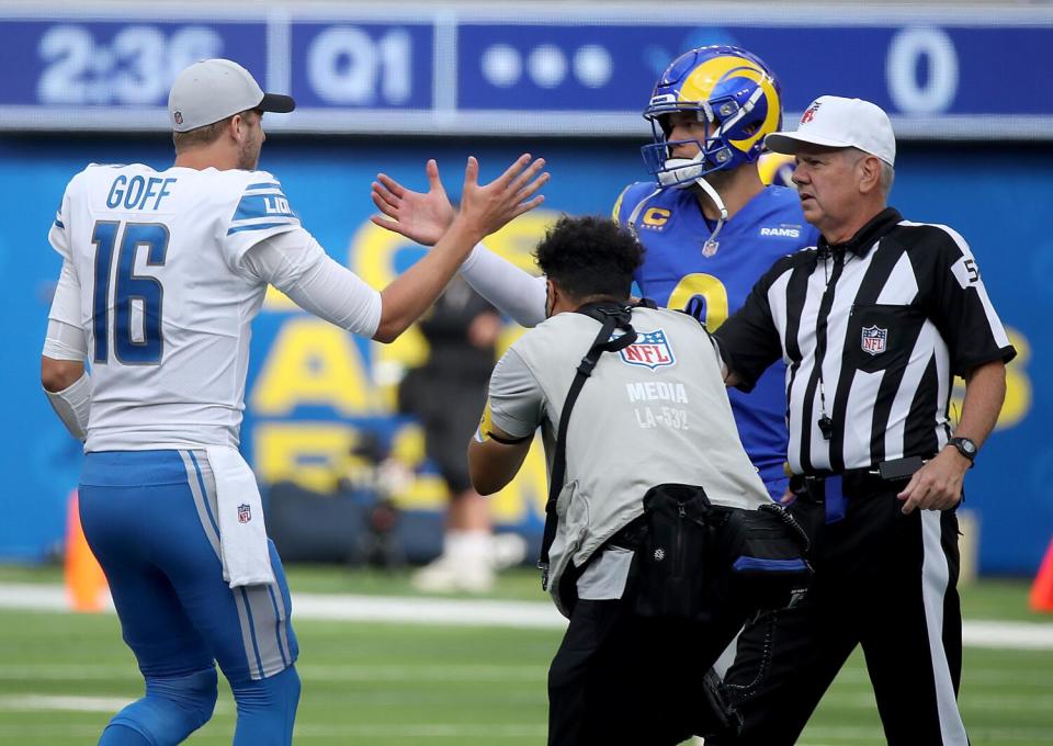 Lions quarterback Jared Goff, left, meets Rams quarterback Matt Stafford.