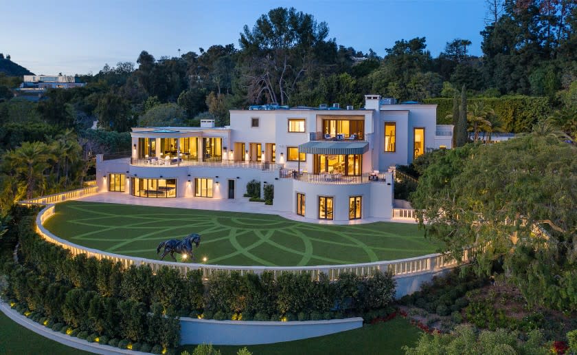 Set on 2.7 acres, the contemporary mega-mansion spans 27,000 square feet and includes a guesthouse, swimming pool and tennis court.