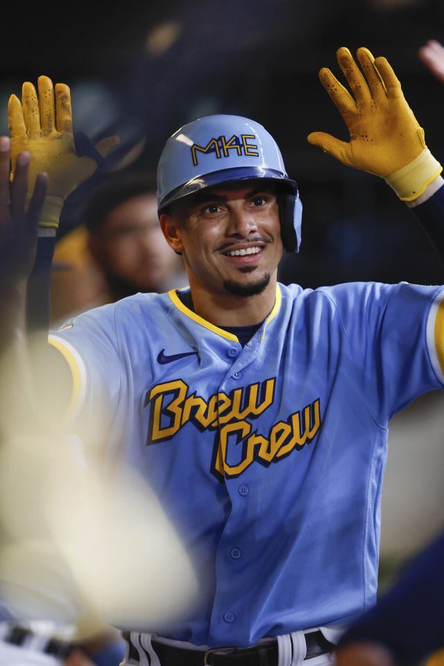 Milwaukee Brewers' Luis Urias watches his solo home run off Colorado  Rockies relief pitcher Jake Bird during the ninth inning of a baseball game  Wednesday, Sept. 7, 2022, in Denver. (AP Photo/David