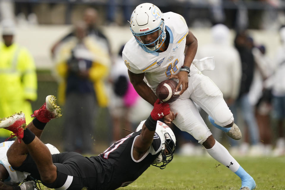 Jackson State linebacker Baron Hopson strips Southern University quarterback Besean McCray of the ball as he tries to run upfield during the first half of an NCAA college football game in Jackson, Miss., Saturday, Oct. 29, 2022. McCray recovered his fumble. (AP Photo/Rogelio V. Solis)