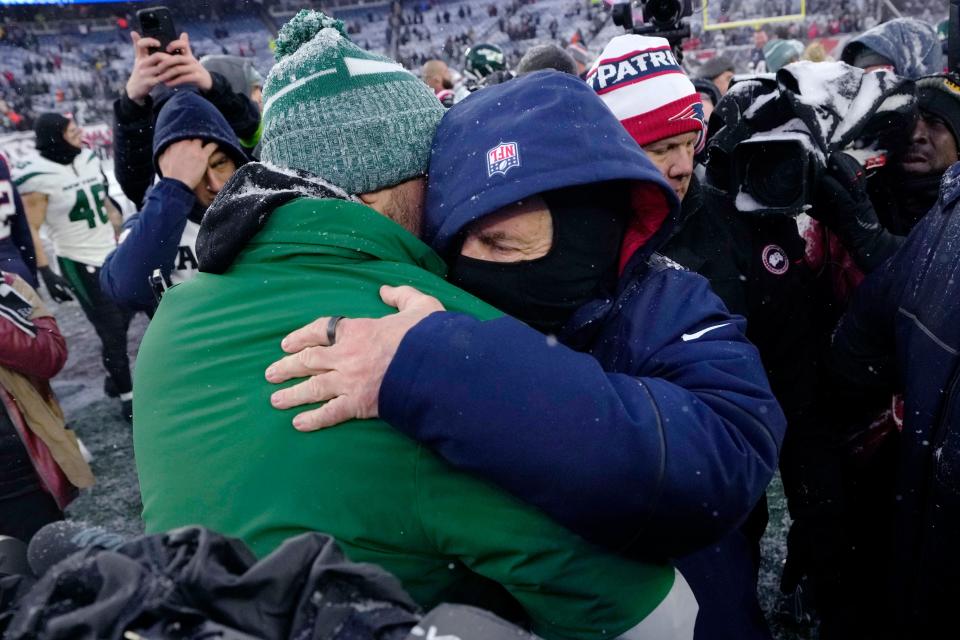 New England Patriots head coach Bill Belichick, right, embraces New York Jets quarterback Aaron Rodgers after an NFL football game, Sunday, Jan. 7, 2024, in Foxborough, Mass. (AP Photo/Steven Senne)