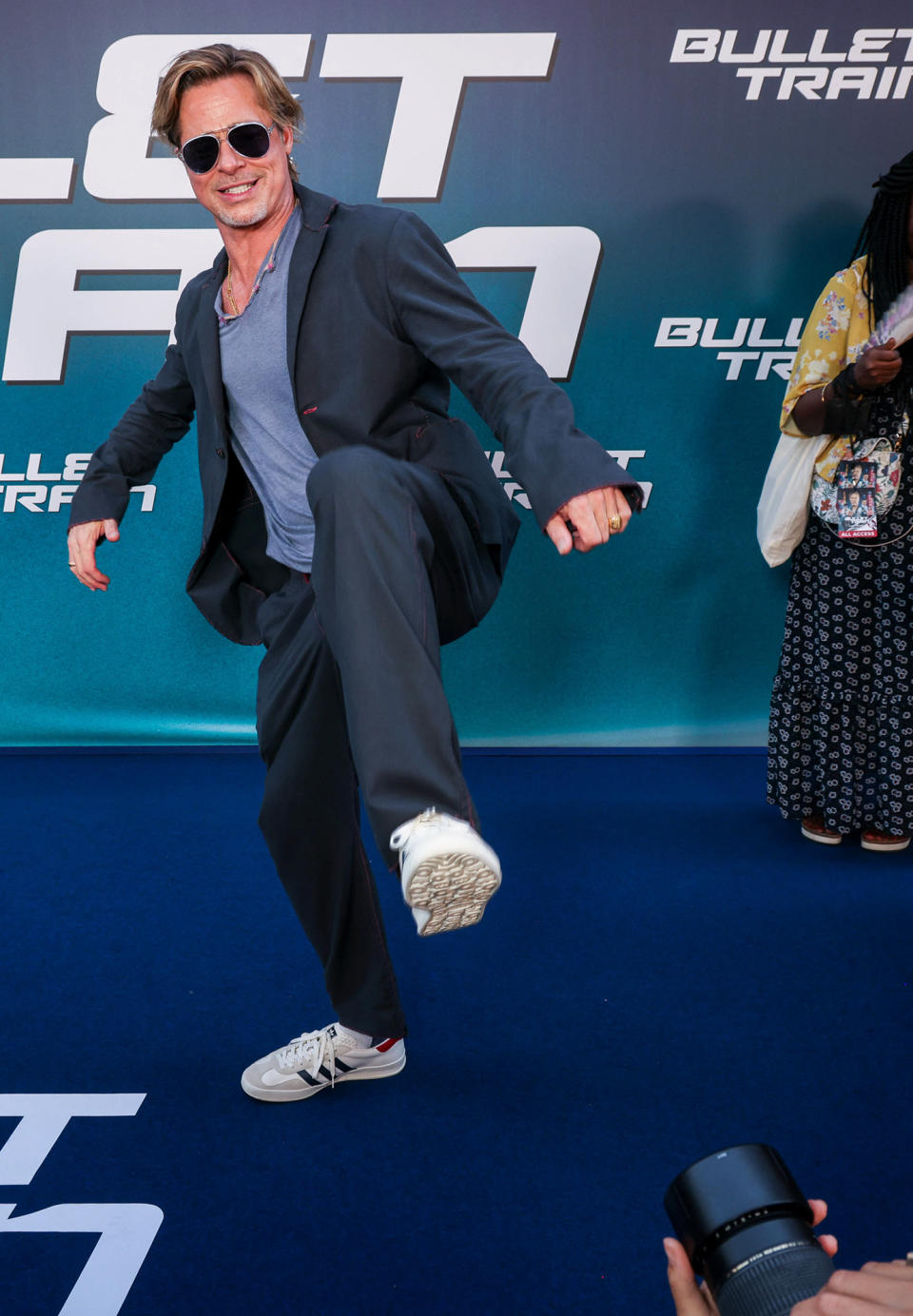 <p>Brad Pitt has some fun at the Paris premiere of <em>Bullet Train</em> at Le Grand Rex on July 18.</p>