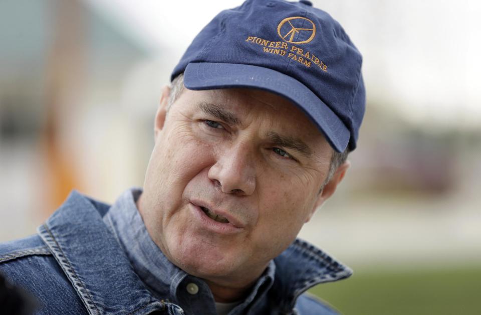 Rep. Bruce Braley, D-Iowa, talks with area farmers as he tours the East Central Iowa Co-Op in Cedar Falls, Iowa. (AP Photo/Charlie Neibergall)