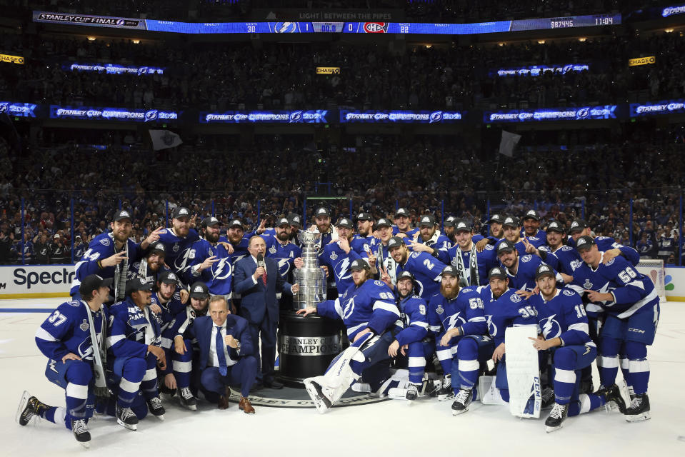 The Tampa Bay Lightning pose with the Stanley Cup after defeating the Montreal Canadiens 1-0 in Game 5 to win the NHL hockey Stanley Cup Finals, Wednesday, July 7, 2021, in Tampa, Fla. (Bruce Bennett/Pool Photo via AP)
