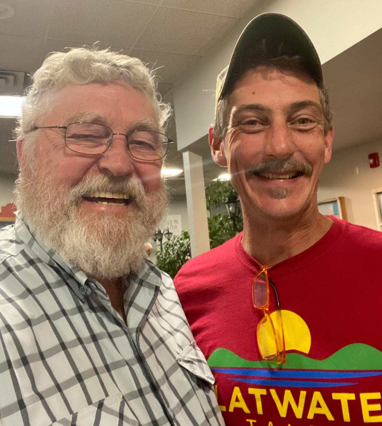 Say "cheese": Oak Ridge City Historian D. Ray Smith and storyteller Bil Lepp pose for a photo.