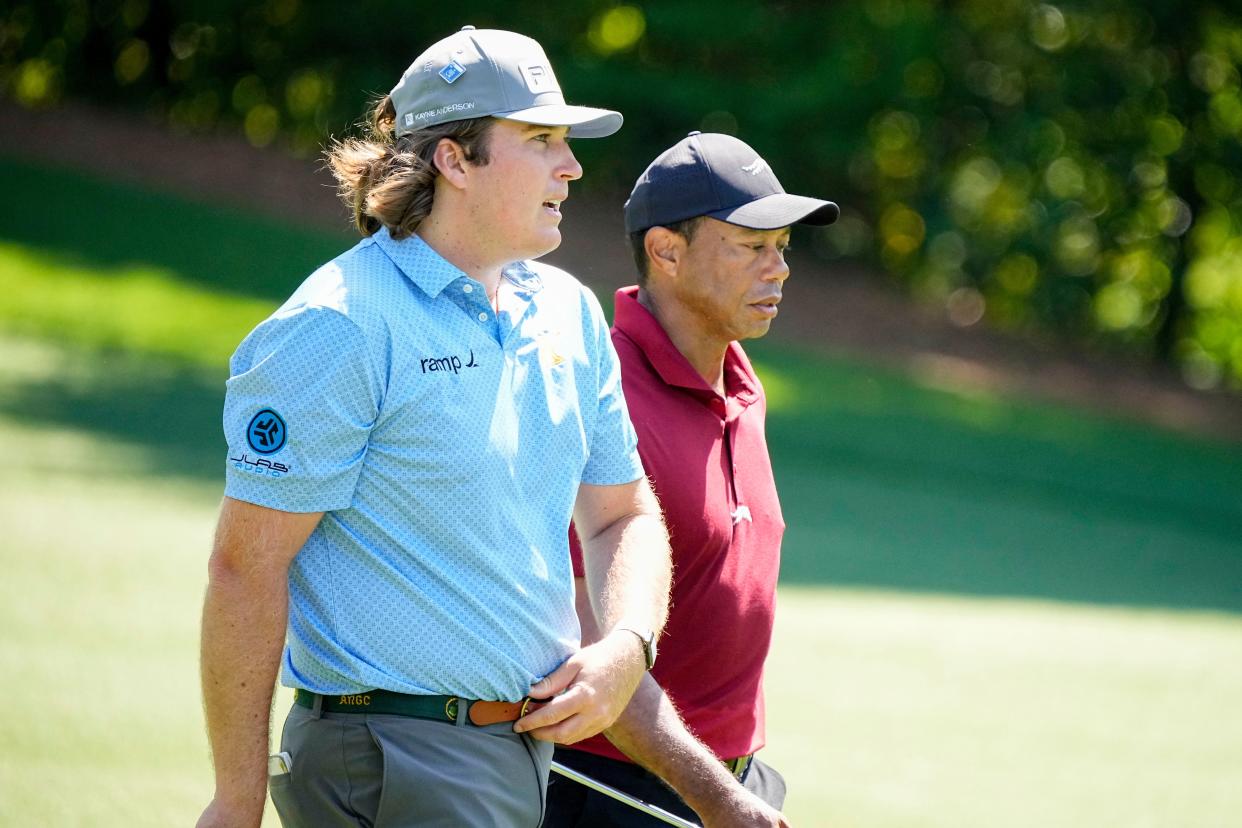 Apr 14, 2024; Augusta, Georgia, USA; Neal Shipley talks with Tiger Woods as they walk down No. 11 during the final round of the Masters Tournament. Mandatory Credit: Adam Cairns-USA TODAY Network