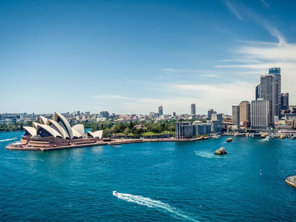 A view of the Sydney harbor with boats in the water.