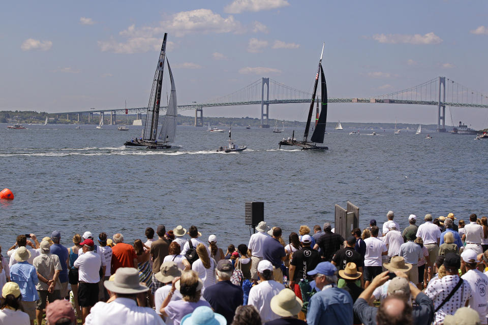 Spectators at Fort Adams State Park watch a match race at the first day of the America's Cup World Series regatta in Newport, RI., Thursday, June 28, 2012. State tourism officials say 7,400 people attended the first day of racing and hope 50,000 people in total will visit the nine-day event, which features four days of racing. (AP Photo/Stephan Savoia)