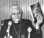 FILE - Cardinal Joseph Ratzinger presents a book with the documents issued by the Congregation for the Doctrine of the Faith during a press conference at the Vatican on Dec. 12, 1985. Ratzinger went on to become Pope Benedict XVI. Pope Emeritus Benedict XVI, the German theologian who will be remembered as the first pope in 600 years to resign, has died, the Vatican announced Saturday. He was 95. (AP Photo/Bruno Mosconi, File)