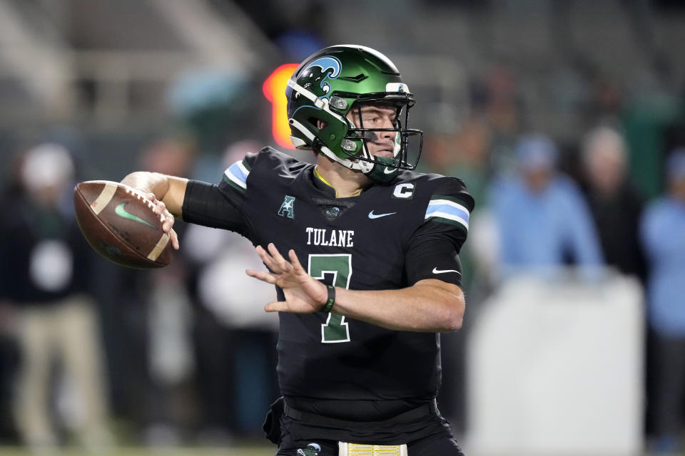 Tulane quarterback Michael Pratt (7) passes during the first half of an NCAA college football game against Southern Methodist in New Orleans, Thursday, Nov. 17, 2022. (AP Photo/Gerald Herbert)
