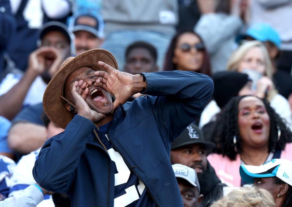 A Dallas Cowboys fan yells support to the team during second half action against the Carolina Panthers at Bank of America Stadium in Charlotte, NC on Sunday, November 19, 2023. The Cowboys defeated the Panthers 33-10.