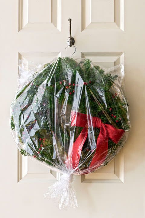 <p>Treat wreaths with the same care you give your favorite party dress. Slip the hoop over the neck of a <a href="https://www.amazon.com/White-Plastic-Standard-Hangers-Notched/dp/B01ND40XXP/" rel="nofollow noopener" target="_blank" data-ylk="slk:coat hanger;elm:context_link;itc:0;sec:content-canvas" class="link ">coat hanger</a>, then cover with a plastic dry-cleaning bag to prevent a year's worth of dust from building up. Hang it in a closet or from a beam in your attic.</p><p><strong>RELATED: </strong><a href="https://www.goodhousekeeping.com/holidays/christmas-ideas/how-to/g1253/diy-christmas-wreaths/" rel="nofollow noopener" target="_blank" data-ylk="slk:Christmas Wreath Ideas to Add Festive Cheer to Your Front Door;elm:context_link;itc:0;sec:content-canvas" class="link ">Christmas Wreath Ideas to Add Festive Cheer to Your Front Door </a></p>