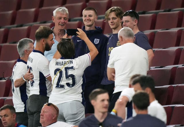 England player Adam Wharton with his family after the match in Cologne