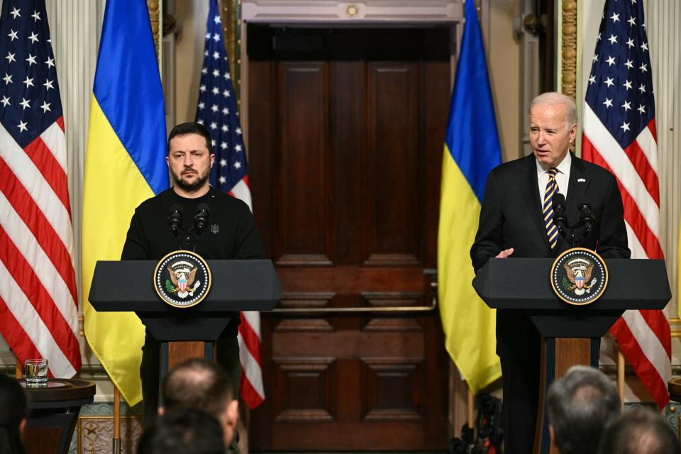 US President Joe Biden and Ukraine's President Volodymyr Zelensky hold a joint press conference in the Indian Treaty Room of the Eisenhower Executive Office Building, next to the White House, in Washington, DC, on December 12, 2023.