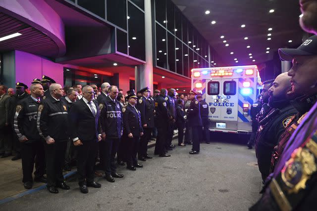 <p>Kyle Mazza/NurPhoto via AP</p> Officers paying their respects to the late NYPD Officer Jonathan Diller