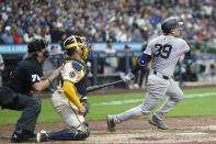 New York Yankees' Jose Trevino hits a two-run scoring single during the sixth inning of a baseball game against the Milwaukee Brewers Sunday, April 28, 2024, in Milwaukee. (AP Photo/Morry Gash)