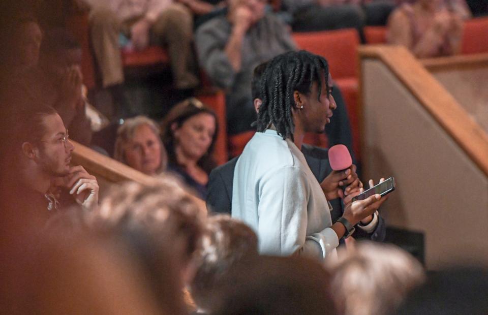 Jaden Tolbert asks a question about affirmative action to guest speaker Candace Owens at the Turning Point USA at Clemson University event titled "All Lives Matter" in Memorial Auditorium in Clemson Tuesday, April 4, 2023.