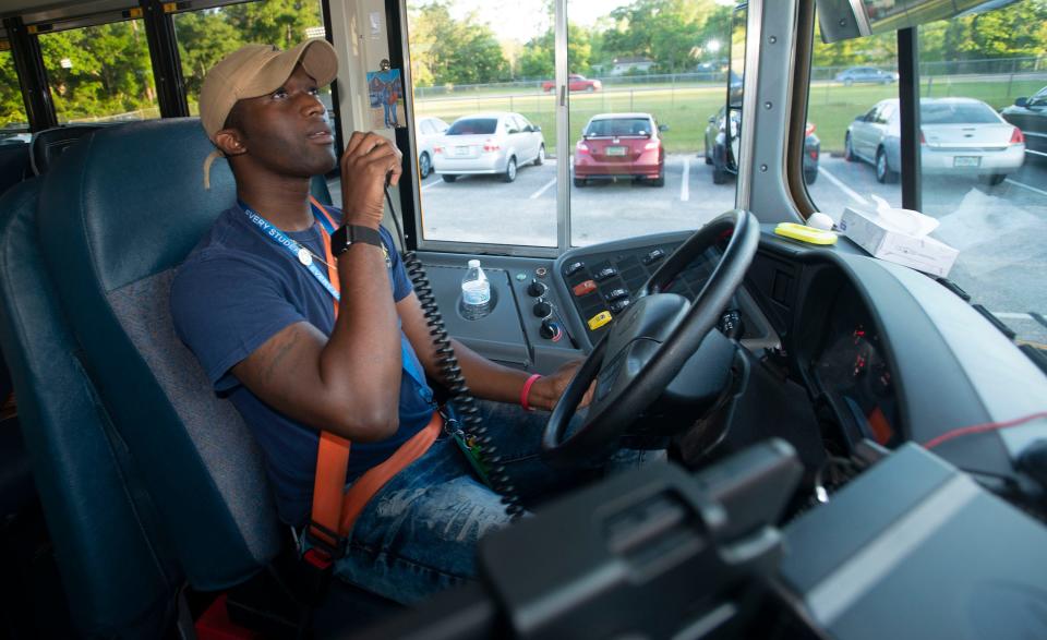Cordarius Jones, a bus driver for the Escambia County School District, drives his route April 28. Jones, also known as "Mr. Bus Driver," is making a name for himself on social media.