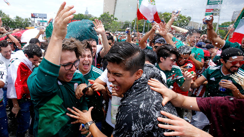 Jubilant Mexico fans celebrate Lozano’s match-winning goal against Germany. Pic: Getty