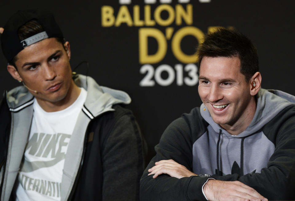 Cristiano Ronaldo of Portugal, left, and Lionel Messi of Argentina, right, nominees for the Men's World Soccer Player of the year, answer journalists questions during a press conference at the FIFA Ballon d'Or awarding ceremony in Zurich, Switzerland, Monday, Jan. 13, 2014. (AP Photo/Keystone,Steffen Schmidt)