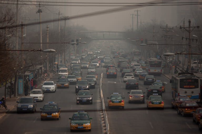 Traffic makes its way through Beijing, on January 12, 2013. A two-year-old Chinese girl who was thrown to the ground by a man in his 40s during a row with her mother over parking has died, state media reported on Saturday