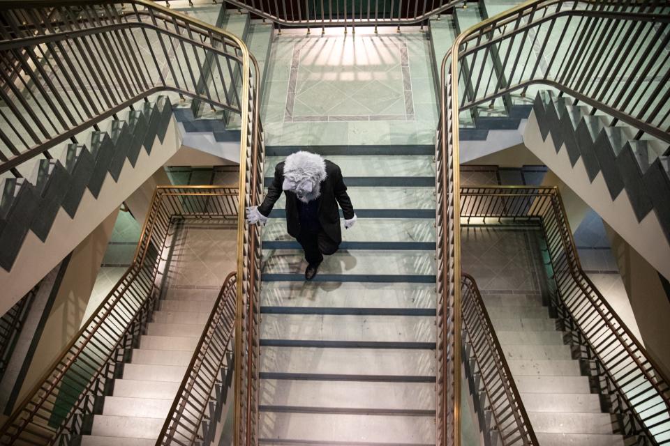 Drake McElyea, portraying The Big Bad Wolf, leaves the district courtroom a free wolf after being found not guilty during a mock trial at the Federal Courthouse on Thursday, Nov. 16, 2023, in Corpus Christi, Texas.