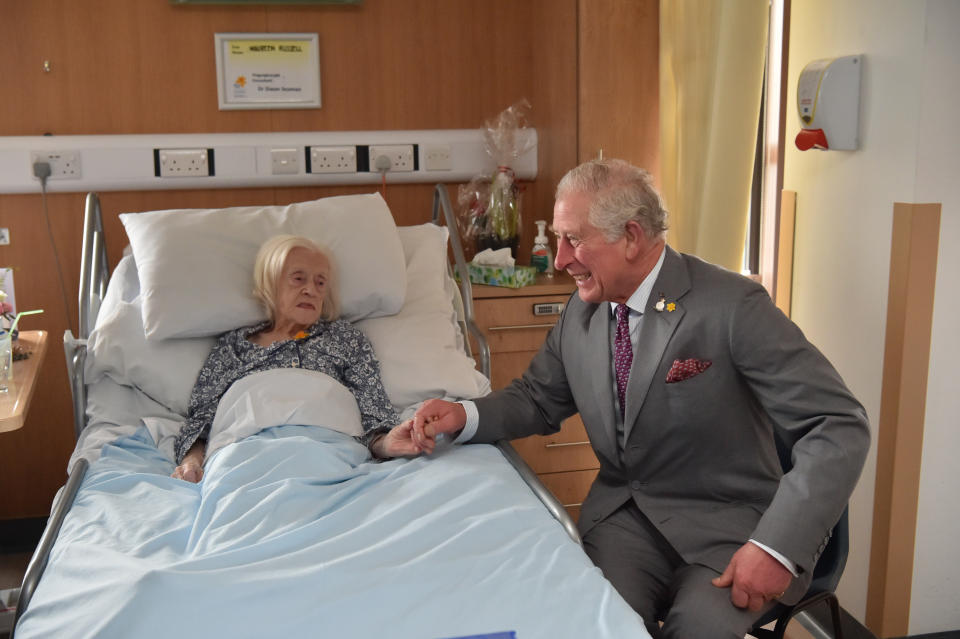 The Prince of Wales meeting patient Maureen Russell, 97, during a visit to the Marie Curie Hospice in Cardiff and the Vale, Wales.