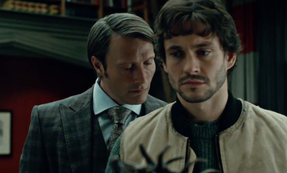 Hannibal Lecter leans in to smell the back of Will Graham's neck as he is turned away from him
