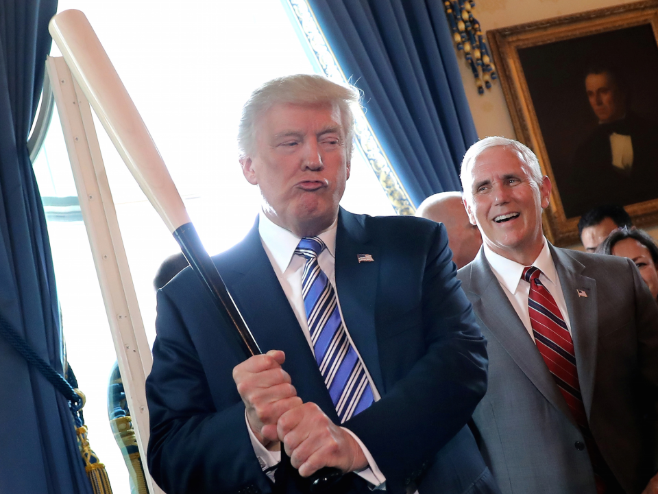 Vice President Mike Pence laughs as U.S. President Donald Trump holds a baseball bat as they attend a Made in America product showcase event at the White House in Washington, U.S. (Photo: Reuters)