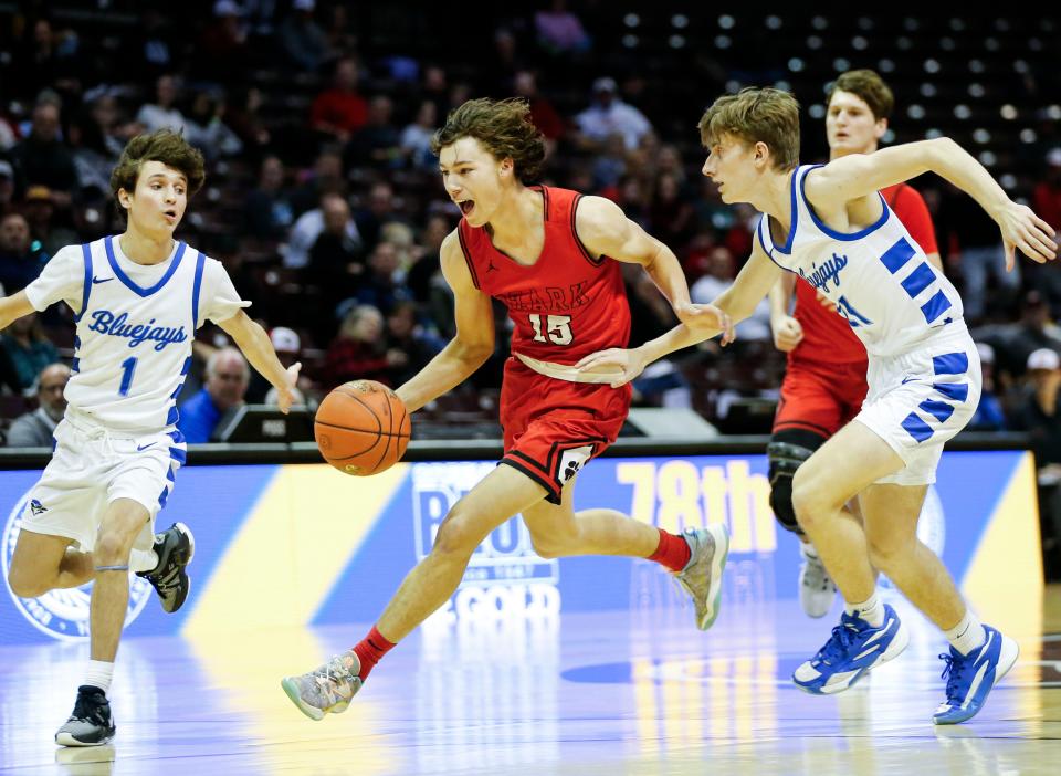 Ozark's Hudson Roberts drives to the basket as the Tigers took on the Clever Bluejays in the first round of the Gold Division during the Blue and Gold Tournament at Great Southern Bank Arena on Tuesday, Dec. 26, 2023.