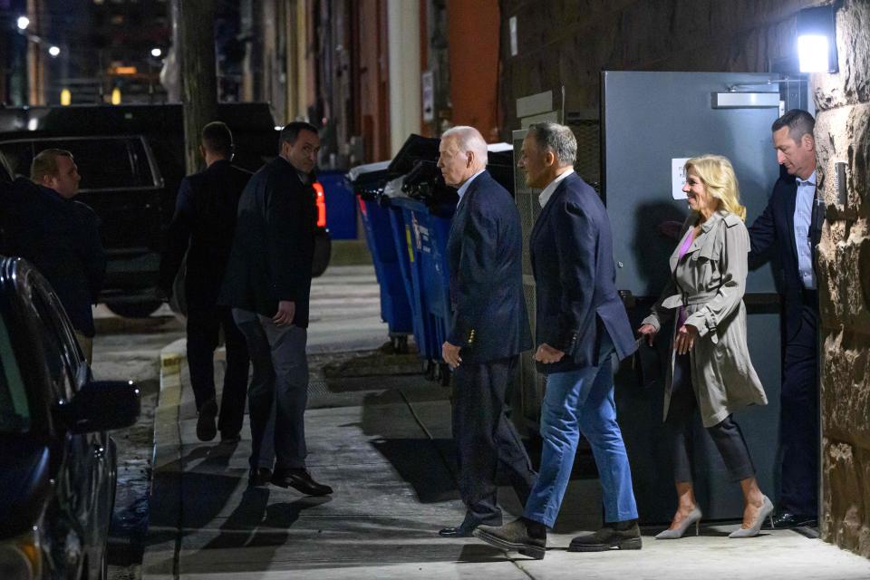 President Joe Biden (center) and First Lady Jill Biden (second right) leave The Quoin Hotel &amp; Restaurant after dinner in Wilmington on March 18, 2023.