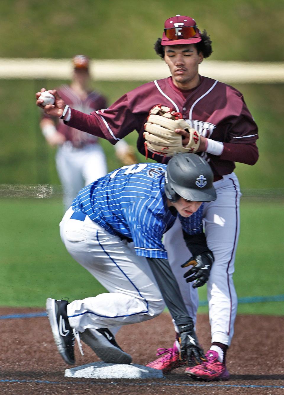 Sailor Jason Bellucci tries to break up a double play attempt by Falmouth second baseman Tre' Chaun Days. Scituate baseball hosts Falmouth on Friday, April 19, 2024.