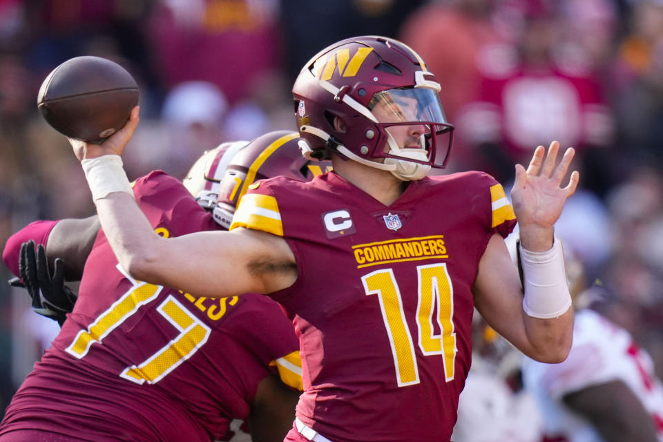 Washington Commanders quarterback Sam Howell (14) throwing the ball during the first half of an NFL football game against the San Francisco 49ers, Sunday, Dec. 31, 2023, in Landover, Md. (AP Photo/Alex Brandon)