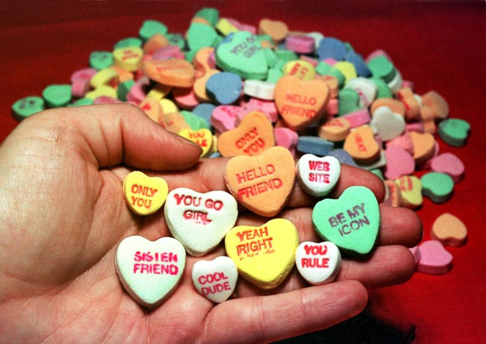 Necco&nbsp;candy hearts from 1998 with phrases like "YOU GO GIRL" and "WEB SITE." (Photo: Jim Bourg / Reuters)