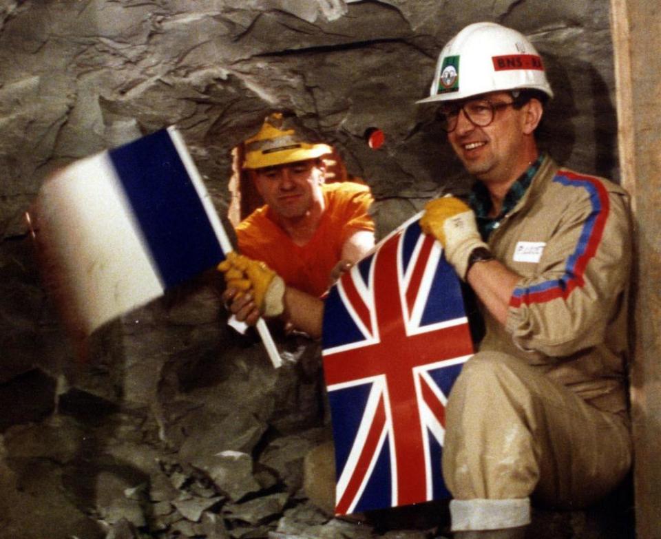 English tunneller Graham Fagg (left) meeting Frenchman Phillippe Cozette as the two sides of the Channel Tunnel met in 1990.