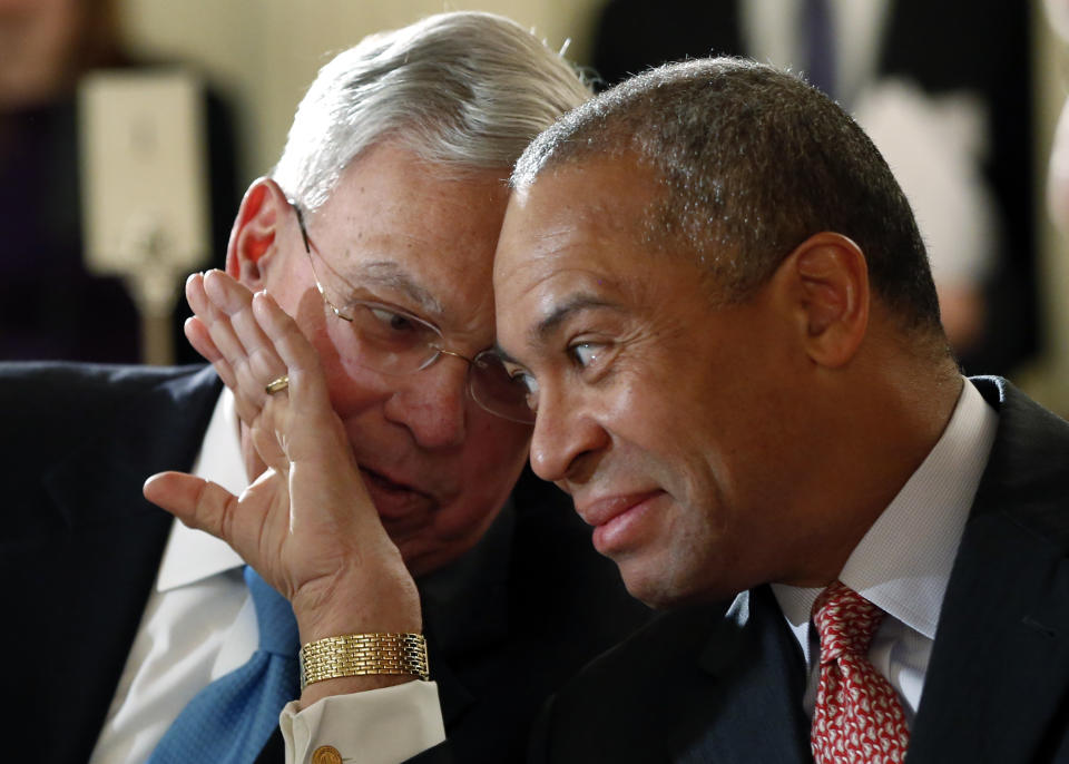 Former Boston Mayor Thomas Menino, left, and Mass. Gov. Deval Patrick huddle prior to their speeches at a forum entitled, "Leading Cities Through Crisis: Lessons from the Boston Marathon" held at Boston University in Boston, Monday, March 24, 2014. (AP Photo/Elise Amendola)