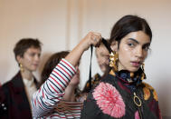 <p>Hair ribbons were a key feature of the beauty look backstage at Mother Of Pearl. <em>[Photo: PA]</em> </p>